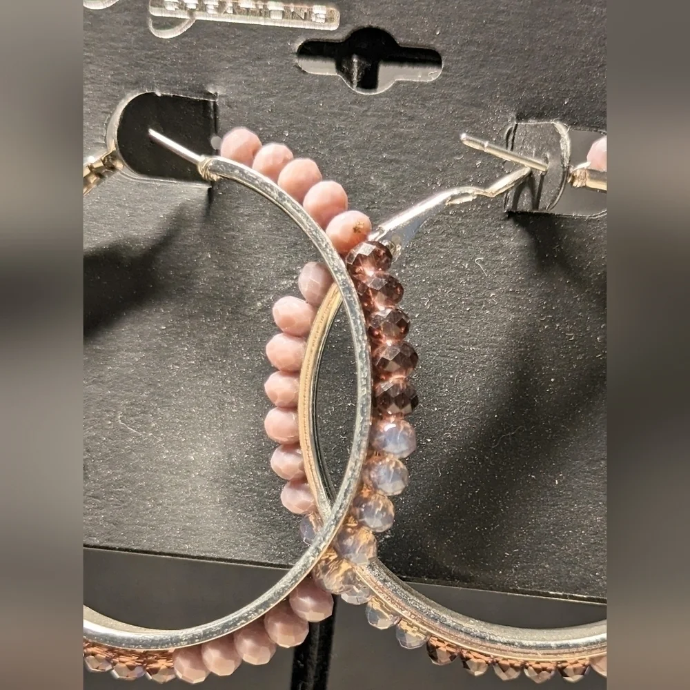 Tanya Creations Earrings NWT. Hoop earrings with crystals along edges.